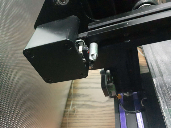 a metal rod wrapped in duct tape wedged between the emergency stop switch on an Ender 3