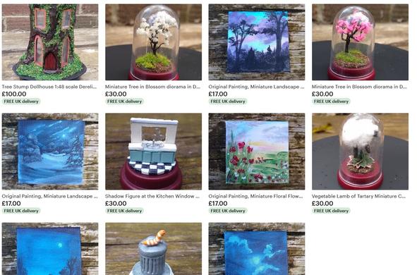 Screenshot of my Etsy shop. There is a tree stump miniature doll house model, Miniature trees in little plastic thumb domes, tiny acrylic paintings, all sorts of fun things!