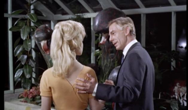 Michael Gough as Dr. Charles Decker putting his pinky-ringed hand on the back of Claire Gordon as Sandra Banks in Konga (1961)