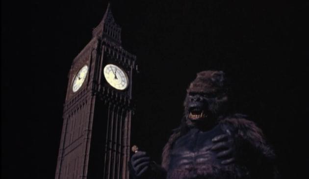 The gigantic ape, holding a tiny man in his hand, stands next to Big Ben’s clock face reading 11:55 in Konga (1961)
