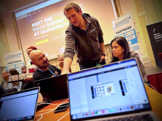 Three developers discussing frontend issues and finding creative solutions.