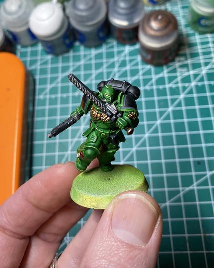 A Salamander space marine assault intercession. He’s green. The base is unfinished.