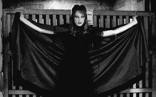 My model & art muse friend, Marina. As a vampire with velvet cape spread in front of an old elevator.