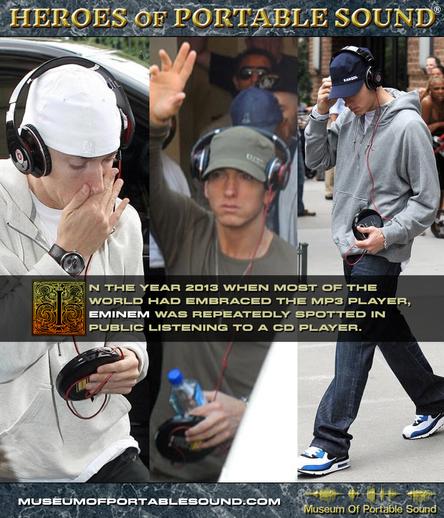 Three photographs of hip hop artist Eminem from the year 2013. Altho dressed differently in each photo, he wears the same pair of black Beats wired headphones plugged into a black portable CD player. A headline at the top of the image, in gold chiseled type floating above a dark marble background, reads "HEROES OF PORTABLE SOUND".