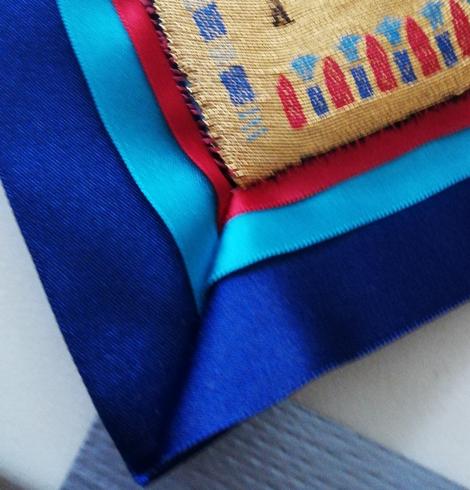 Closeup of a corner of the border. All the fabrics are puckered, so there is more to do..