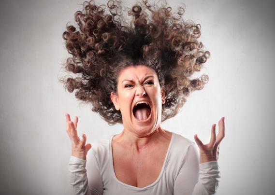 woman screaming with hair standing up in the air - deposit photos