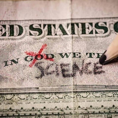 USD bill pic depicting “ in god we trust” motto ￼ with the word God crossed out, and the word science put in its place.