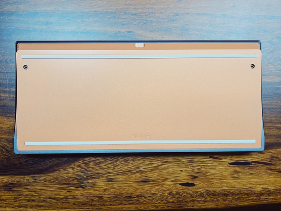Copper keyboard bottom with light gray rubber feet