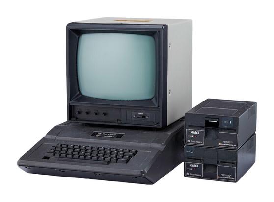 A 1979 Bell & Howell "Apple II Plus" computer system; together with Bell & Howell Apple II drives (labeled Disk I & II) and a Sanyo monitor.

Computer Model Number: 3048D / Drive 1 Model Number: A2M0003 / Drive 2 Model Number: A2M0003 / Monitor Model Number: DM 5112CX

Computer Serial Number: 1127031 & A2S3-010797 / Drive 2 Serial Number: 428518;

No serial numbers present for drive 1 and monitor.

This Apple II was licensed to Bell & Howell by Apple specifically for educational markets and has been nicknamed "Black Apple" and "Darth Vader" because of its atypical dark case.