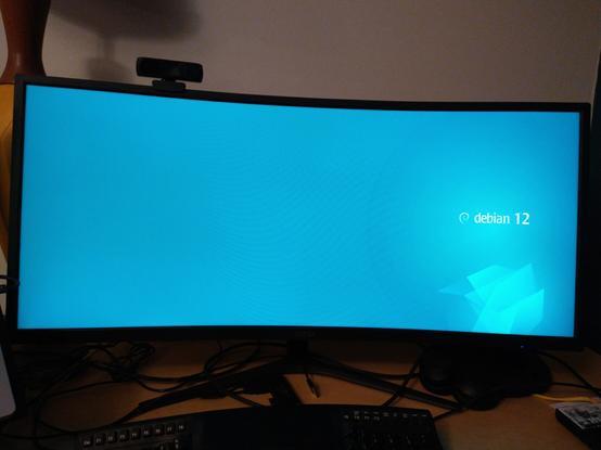 Ultra wide screen showing debian 12 "emerald" boot splash, but missing the prompt for luks passphrase