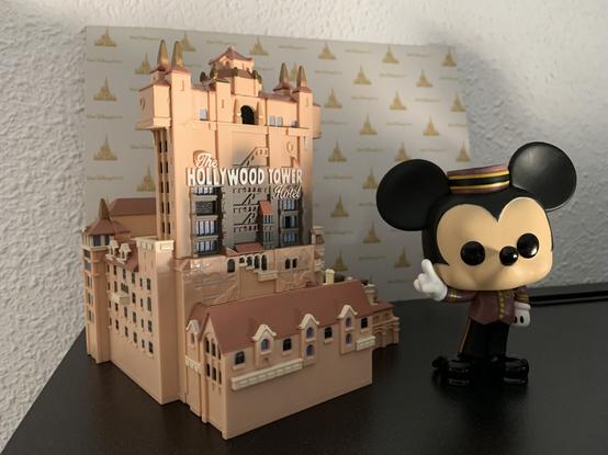 Funko Pop model of Tower of Terror, including a Mickey Mouse figure dressed exactly like the cast members from the real ride.