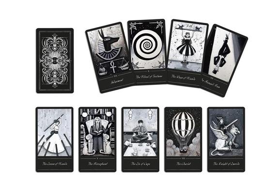 Some example card images from the Erin Morganstern Phantomwise Tarot deck. All are black and white themed, a mix of fantasy, fantastical and surreal. Images include a Egyptian gods, a balloon and a figure sitting reading in a library surrounded by cats.