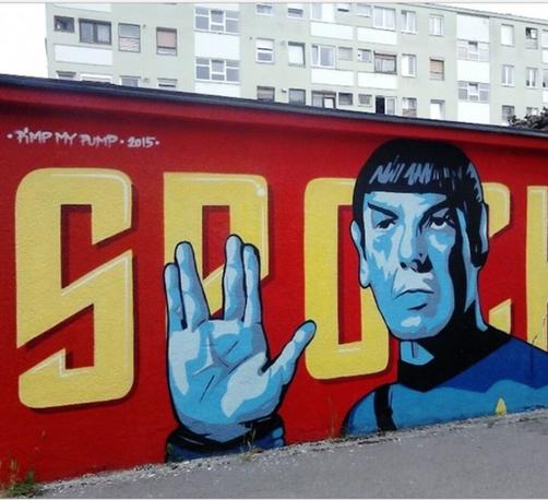 On a red street wall in Zagreb is sprayed / painted the blue comic version of Mr. Spock, showing his Vulcan greeting.  (Little finger and ring finger together, gap, the remaining fingers together). Behind it, in yellow lettering, is "Spock."
Info: Star Trek fans celebrate March 26 as the international or intergalactic Live Long and Prosper Day (LLAP Day) The greeting of the Vulcan Mr. Spock in the series Enterprise and the birthday of the late actor Leonard Nimoy are extensively celebrated on this day.
The gesture was first seen in Episode 5 of Season 2, the original Star Trek series. The episode was titled Amok Time in the original U.S. version and aired on Sept. 15, 1967.