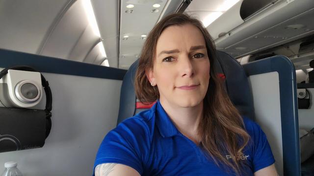 Alyssa in a Delta One pod on board an Airbus A330