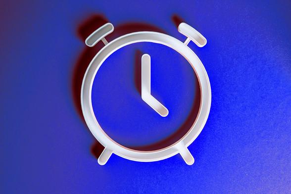 A simple illustration depicts a silver alarm clock against a cobalt-blue background.