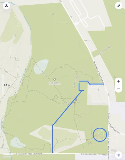 Map of Weelaunee People’s Park with the boundary laid out by the executive order marked. The parking lot is circled. It is approx a quarter mile away from the boundary lines. The path and boundary intersect at Mile 12 on the map.