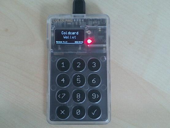 Coldcard hardware wallet with display showing the version.