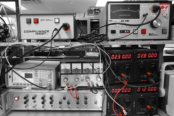 Lab equipment in black and white, with a color pop of red