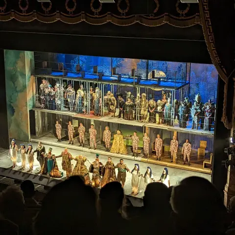 Looking down at a stage as the cast of Akhnaten take the curtain call.