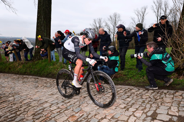 Tadej Pogacar riding cobbled sector on way to victory in Flanders.