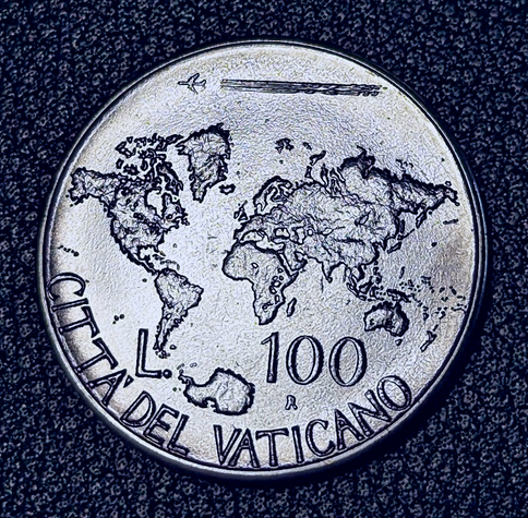 A plane flying over the countries of the world spreading the Gospels.  Text L 100, R, CITTA' DEL VATICANO