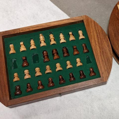 a set of chess pieces with three missing