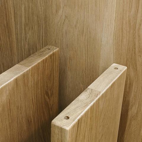 The legs of a white oak bench.