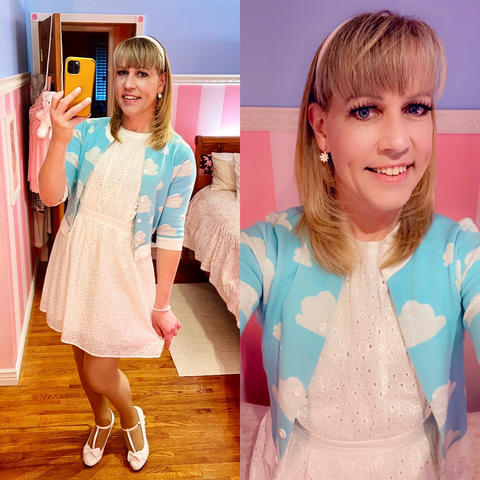 Chrissy is wearing a white dress with a sky-blue cloud cardigan