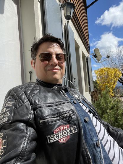 Picture of a guy in the sun listening music.