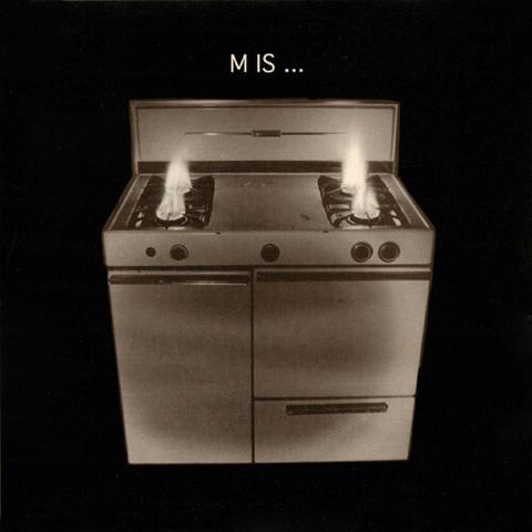 A gas stove with 4 burning gas flames