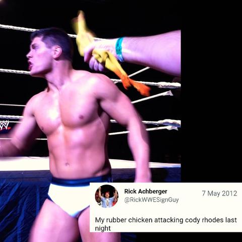 Cody Rhodes performing in a 2012 WWE live event; Got "harassed" with a rubber chicken by wrestling superfan 'WWE Sign Guy'.