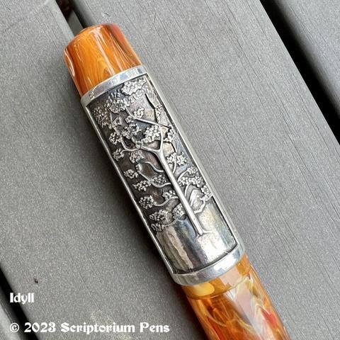 Close up of Silver Panel Rollstop engraved with the image of a maple tree.