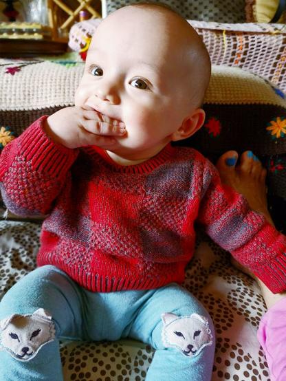 Baby nephew tasting his fingers.