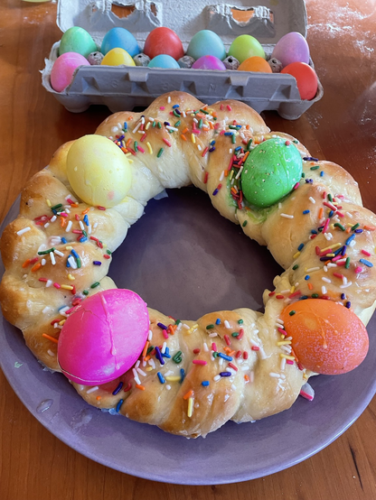 Italian Easter bread wreath with four colored eggs