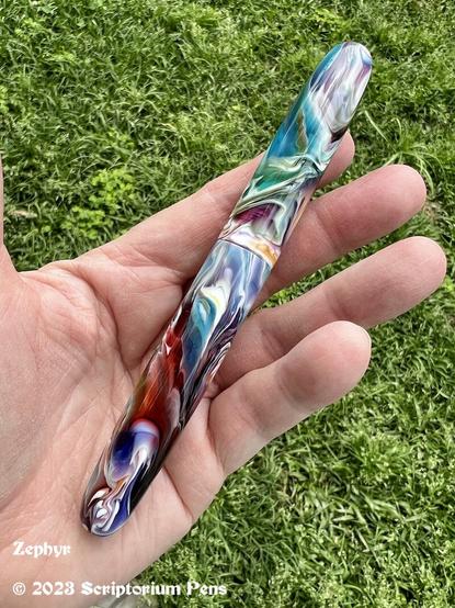 Custom fountain pen made from Primary Manipulation #1, capped, held in maker’s hand.