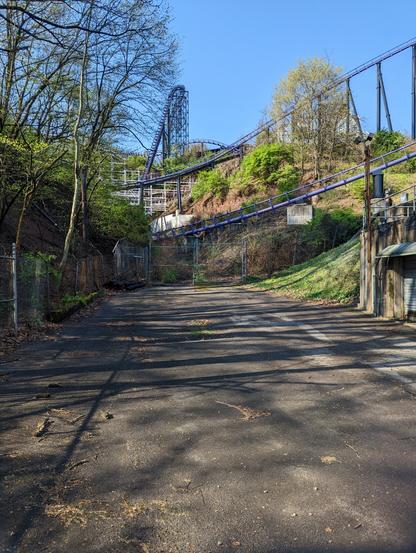 A view of Kennywood as seen from the GAP Trail. Phantoms Revenge's main drop can be seen, as well as peeks of Thunderbolt, both roller coasters using the hilly terrain to add extra thrills.