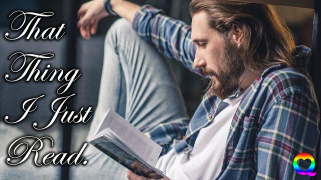 That Thing I Just Read header - Handsome bearded man with light brown hair and beard, seen from the side, wearing a blue plaid shirt, white t-short and faded blue jeans, sitting on the ground and reading a book