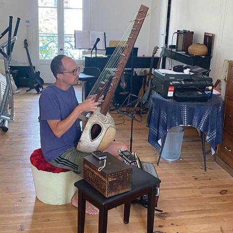 luke sanger playing stringed instrument