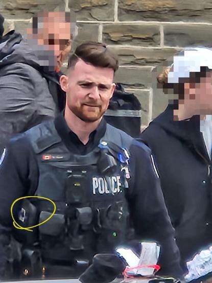 51 Division cop, driver of vehicle 5131, proudly sporting the Thin Blue Line patch (highlighted by a yellow oval) at an arrest.