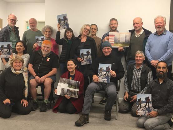 A group photo from Victorian Bushwalkers social night hybrid presentation in person and on zoom . I’m in this photo. Which person am I?