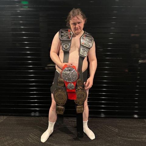 Scottish singer Lewis Capaldi photographed naked wearing only his underwear and socks, along with his WWE toy belts.