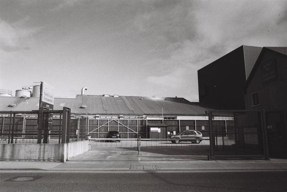 a black and white film photograph of the North Cork Creameries industrial builings in Kanturk, Co. Cork, Ireland