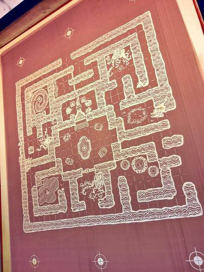 A screen printing screen with no ink, showing the stencil of this map and where the inj passes through
