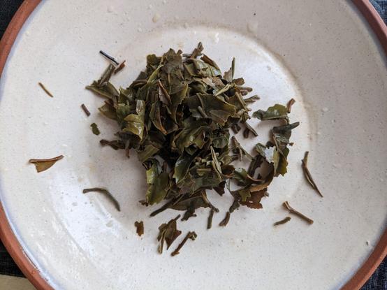Spent tea leaves on a plate.