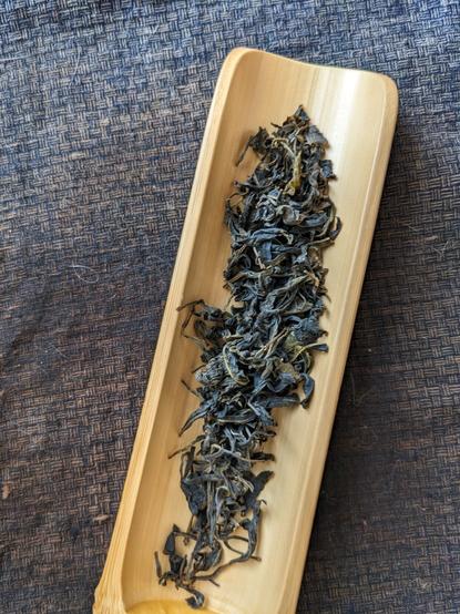 Dry green tea leaves.