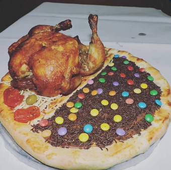 A pizza half sweet, half savoury, featuring both chocolate and an entire grilled chicken on top.