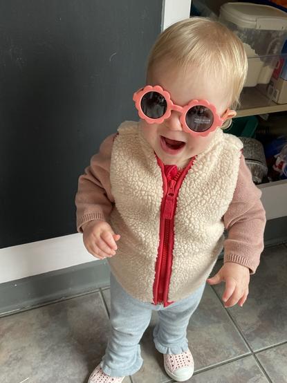 Adorable toddler with flower sunglasses on
