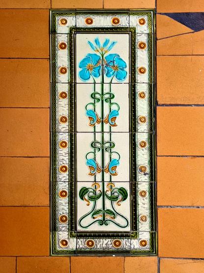 An art nouveau plant and flower based tile design.