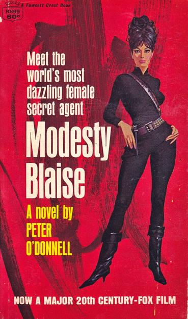 A statuesque brunette woman with a large updo is dressed in a black skintight mod outfit with a slanted belt gun holster and black leather boots.
Meet the
world's most
dazzling female
secret agent
Modesty Blaise
A novel by
PETER
O'DONNELL
NOW A MAJOR 20th CENTURY-FOX FILM
