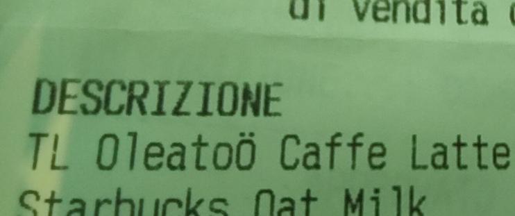 Section of a till receipt. Text is: 
descrizione 
OleatoÖ Caffe Latte